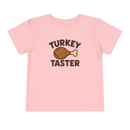 Turkey Taster Toddler Unisex T-Shirt | Fun Holiday Shirt, Thanksgiving Apparel, Gift for Kids, Cute Foodie Outfit